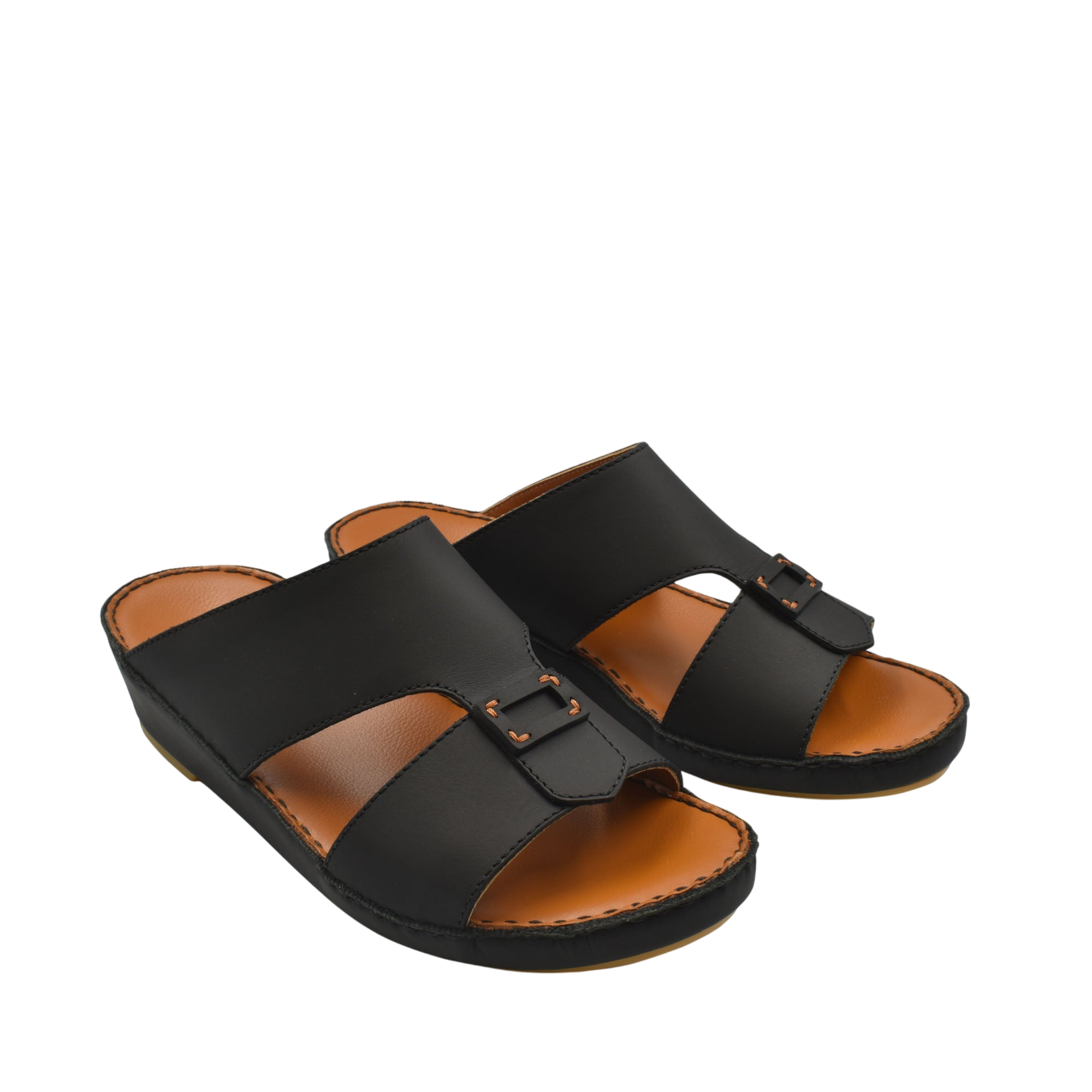 Black Italian leather sandals with buckle detail and tan cushioned footbed from private collection