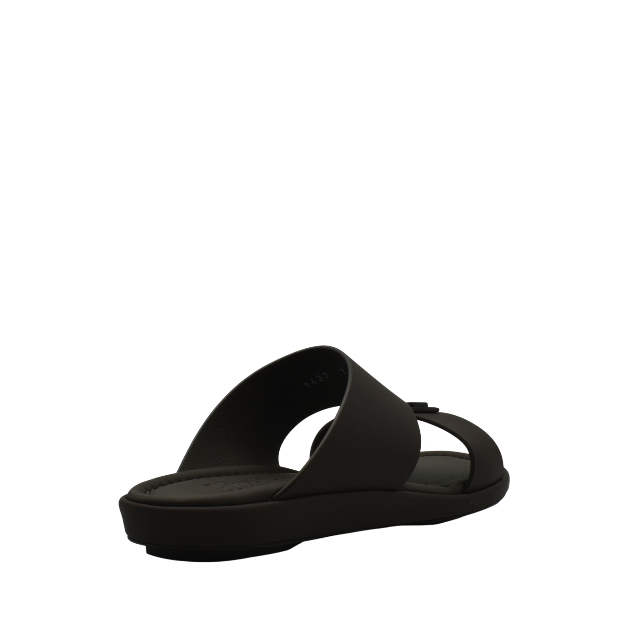 Black slide sandal from Private Collection representing prestige casual footwear with a sleek modern design